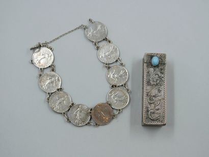 null Bracelet composed of silver coins of 50centimes and a lipstick case of the end...