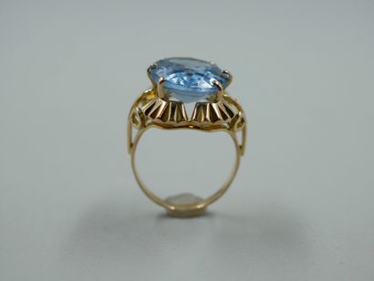 null Ring in 18k yellow gold set with an oval topaz of about 6cts in a collared setting....