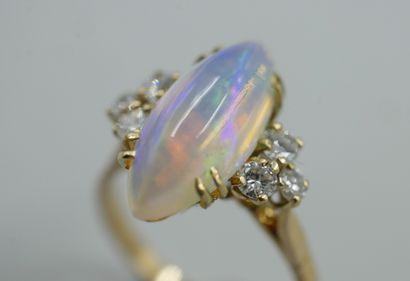 null Yellow gold ring with diamond-shaped opal surrounded by 6 small diamonds. TDD...