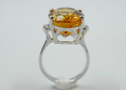 null 18k white gold ring set with a large oval faceted citrine 15cts approximately,...