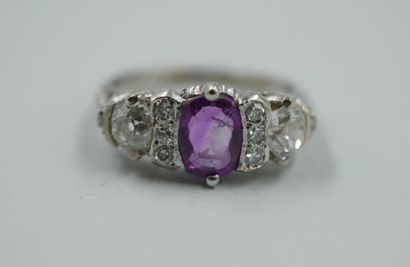 null 18k white gold garter ring set with a pink sapphire and old cut diamonds.

TDD...