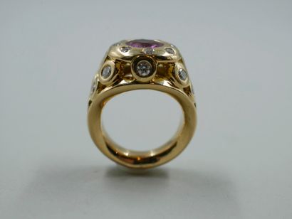 null 18k yellow gold openwork ring set with a pink sapphire and pear and brilliant...