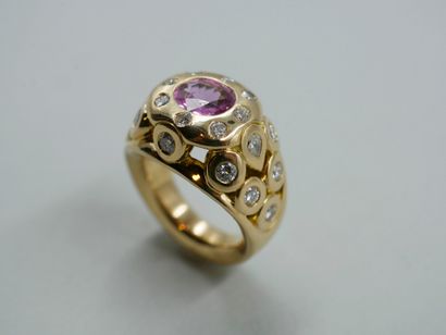 null 18k yellow gold openwork ring set with a pink sapphire and pear and brilliant...