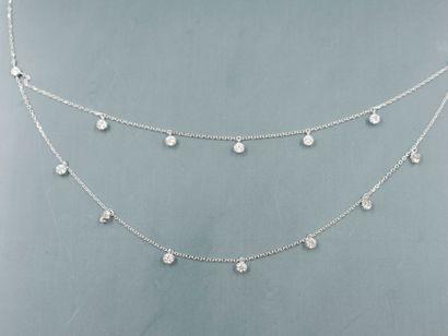 null Necklace in 18k white gold adorned with two rows of chains of brilliant-cut...