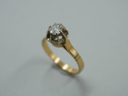 null Solitaire ring in 18k yellow and white gold set with a 0.25ct old cut diamond....
