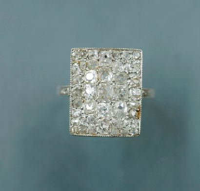 null 
Platinum ring set with a rectangular bezel paved with rose-cut diamonds. 




PB...