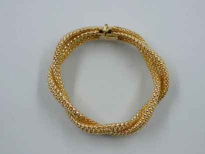 null Bracelet in 18k yellow gold with braided mesh forming a scroll. 

Weight : 37...