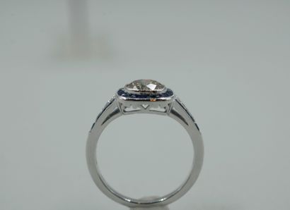 null Art Deco style ring in 18k white gold centered by a diamond of about 1ct in...