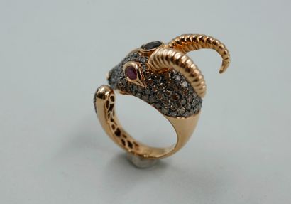 null Ring in 18k yellow gold representing a ram's head paved with diamonds centered...