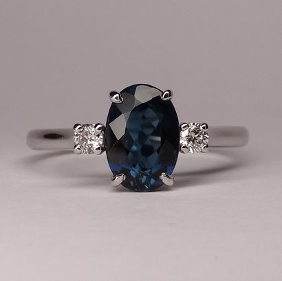 null White gold ring surmounted by an indigolite (blue tourmaline) oval size of 1,50cts...