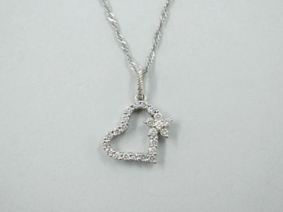 null Heart pendant in 18k white gold decorated with a flower entirely set with diamonds....