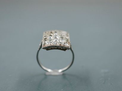 null 
Platinum ring set with a rectangular bezel paved with rose-cut diamonds. 




PB...