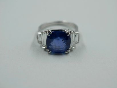  18k white gold ring centered with a 6.28ct cushion blue Ceylon natural sapphire,...