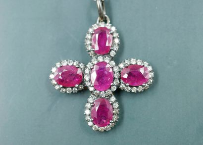 null Silver and 14k gold cross pendant set with 5 oval rubies weighing approximately...