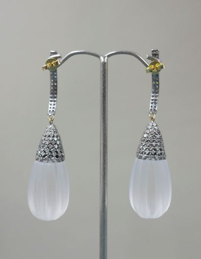 null 
Pair of 14k yellow gold and silver earrings holding a cut crystal pearl with...