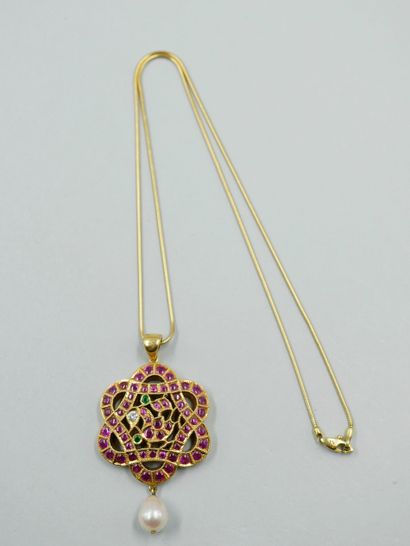 null 18k yellow gold rosette pendant with openwork scrolls set with cabochon rubies,...
