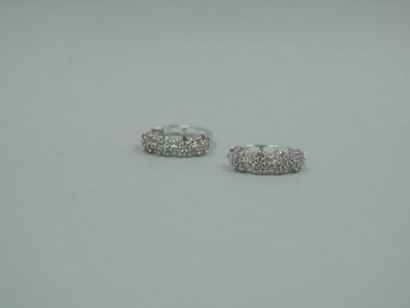 null Pair of 18K white gold hoop earrings set with four brilliant-cut diamonds. 

Dimensions...
