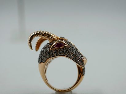 null Ring in 18k yellow gold representing a ram's head paved with diamonds centered...