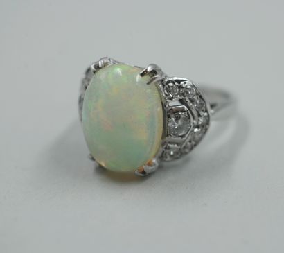 null Antique 18k white gold ring with an oval opal framed by a pavement of small...