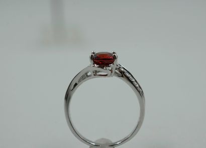 null 18k white gold ring set with a round spessartite garnet of about 2cts, with...