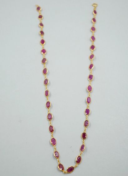null Necklace in 18k yellow gold with 32 rubies in closed setting alternated with...