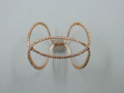 null Ring in 18k pink gold formed by lines of diamonds set with a scroll pattern....