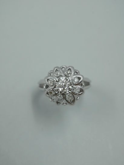 null 18K white gold flower ring set with a central brilliant-cut diamond in a surround...