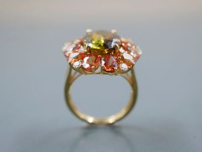null 18k yellow gold daisy ring centered with an oval green tourmaline of about 5cts...