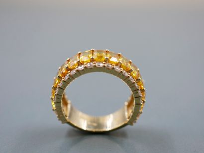 null 18k yellow gold band ring set with a line of rectangular yellow sapphires for...