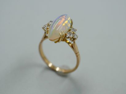 null Yellow gold ring with diamond-shaped opal surrounded by 6 small diamonds. TDD...
