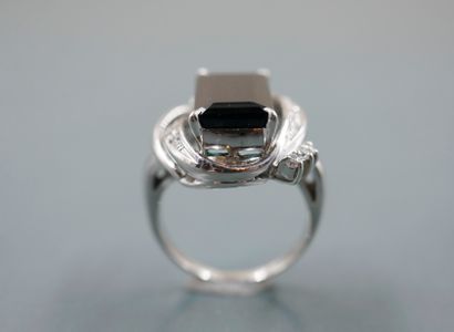 null Ring in platinum set with a large rectangular green tourmaline dressed with...