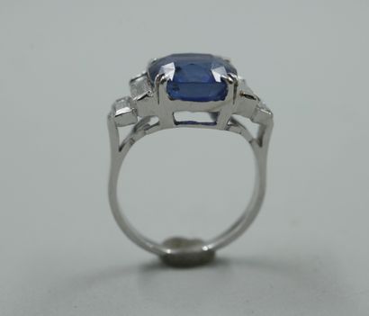 null 18k white gold ring centered with a 6.28ct cushion blue Ceylon natural sapphire,...