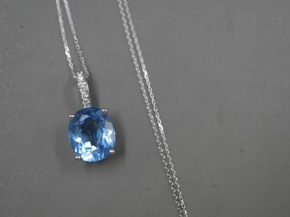 null Pendant in 18k white gold set with a blue topaz "Swiss Blue" oval size of about...