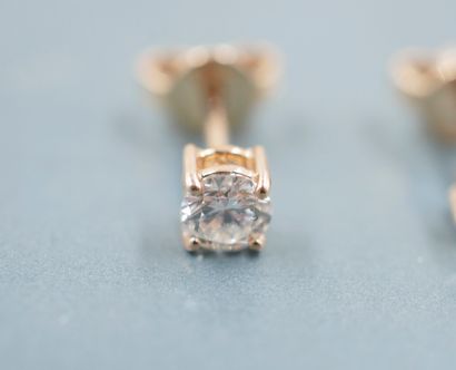 null Pair of 18k yellow gold earrings each set with a diamond for 0.50cts in total....