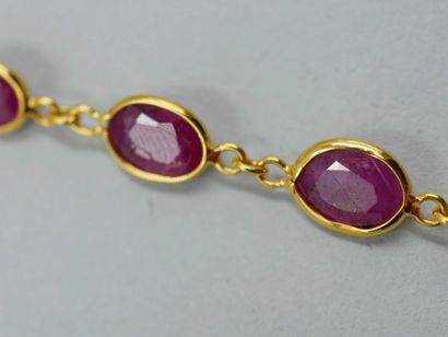 null Necklace in 18k yellow gold with 32 rubies in closed setting alternated with...