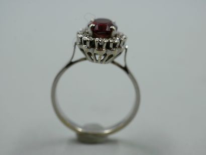 null 18k white gold marquise ring set with a cut garnet in a diamond setting. 

TDD...
