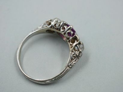 null 18k white gold garter ring set with a pink sapphire and old cut diamonds.

TDD...