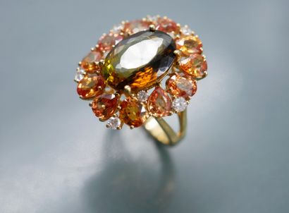 null 18k yellow gold daisy ring centered with an oval green tourmaline of about 5cts...