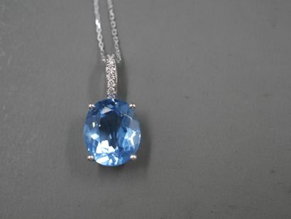 null Pendant in 18k white gold set with a blue topaz "Swiss Blue" oval size of about...