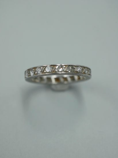 null American wedding band in platinum set with old cut diamonds, the ring engraved...
