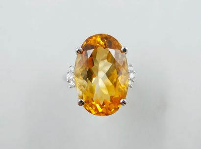 null 18k white gold ring set with a large oval faceted citrine 15cts approximately,...