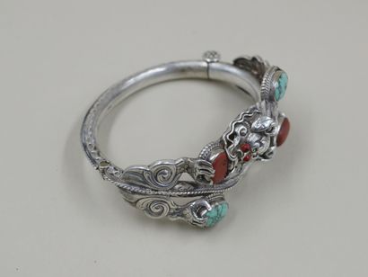 null Bracelet in silver decorated with a Chinese dragon, coral and turquoise. 

PB...