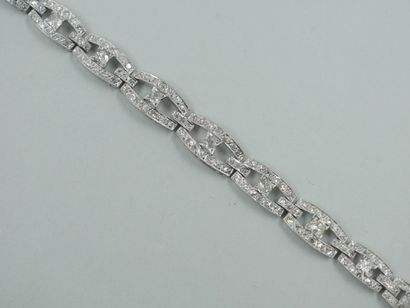 null 18k white gold bracelet with openwork oblong links set with diamonds and centered...