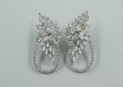 null Pair of 18k white gold earrings with a flower motif set with marquise-cut diamonds...