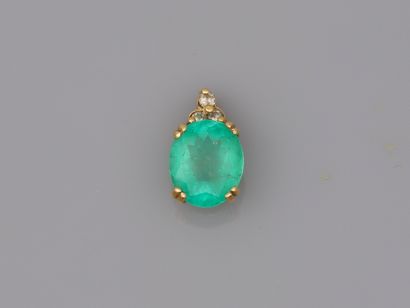 null 18k yellow gold pendant set with a 4cts Colombian emerald of natural origin,...