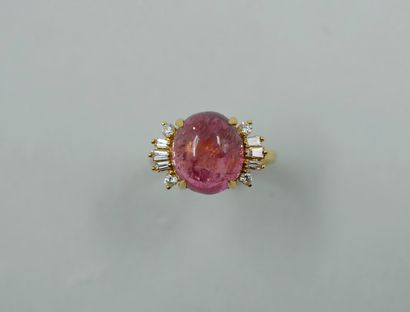 null 18k yellow gold ring topped with a cabochon tourmaline of about 7cts, set with...