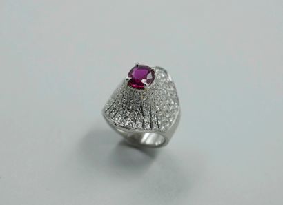 null 
18k brushed platinum ring centered with an oval ruby of about 1.50cts in a...