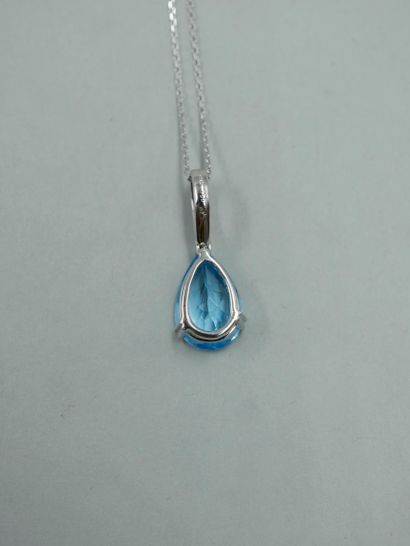 null 18k white gold pendant set with a pear-shaped Swiss Blue topaz of about 3.50cts,...