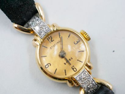 null Lady's watch in 18k yellow gold with domed glass, the case decorated with platinum...