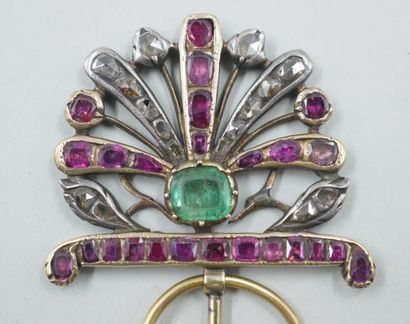 null 
9k yellow gold and silver flowered fibula centered on a rectangular emerald,...